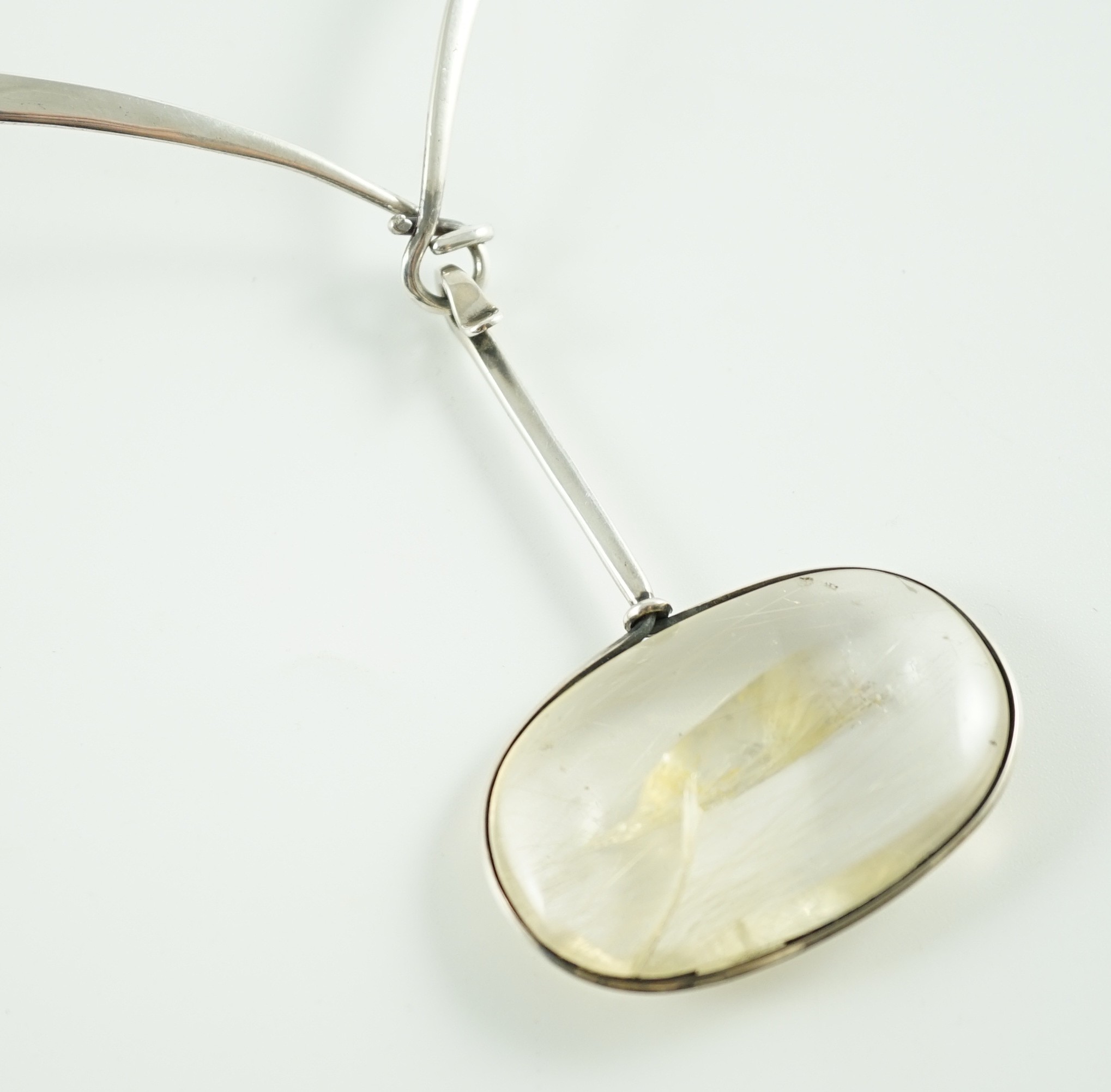 A Vivienne Torun for Georg Jensen Danish sterling silver and rutilated oval quartz set pendant necklace